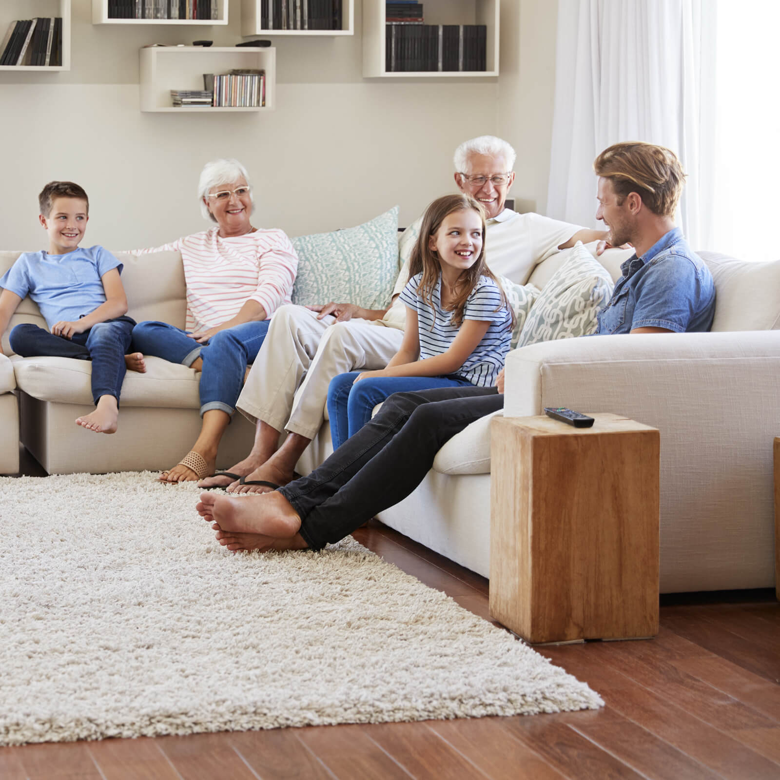 Family enjoying in living room | Blair Mill Outlet