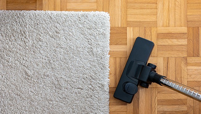 Vacuum cleaner extension on a laminated wooden floor | Blair Mill Outlet